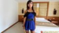 Standing beside bed hands by her sides