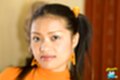 Jantra wearing earrings hair in pigtails