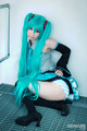 Squatting in cosplay outfit raising hem of skirt over her ass