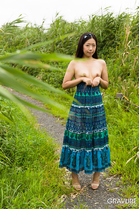 Shaved Miyuki Fukatsu stripping outdoors in wetlands