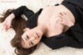 Asagiri akari lying on her back fondling her breasts