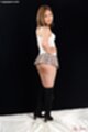 Hidaka ayano looking over her shoulder hand on hip short skirt
