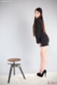 Office lady standing beside tool long hair short skirt high heels