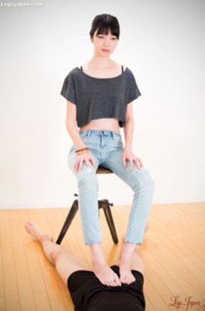 Matsuda Anna sitting on stool wearing jeans giving footjob with bare feet