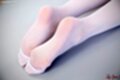 Feet stretched out in stockings