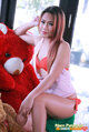 Seated with teddy bear